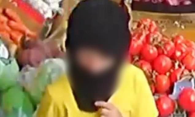 Moment balaclava-clad children as young as five steal from corner shop while their parents wait outside