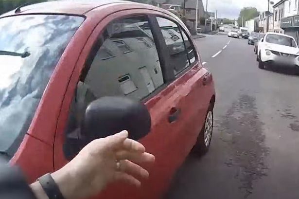 Woman asks cop 'where to?' as she gives him lift in car to catch suspect on the run