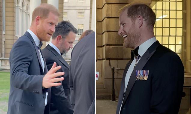 Moment Harry ignores question about Earl Spencer's book but admitted his first two weeks back in UK have been 'eventful…