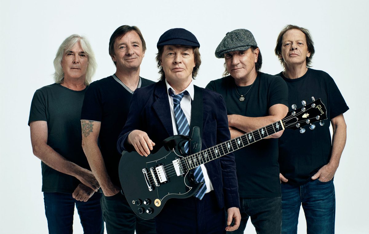Watch AC/DC’s Angus Young sign fan’s baby