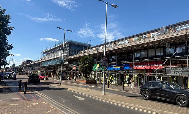 Trapped behind 400ft-long scaffolding in 'British Hollywood': Property firm covers homes and businesses near EastEnders…