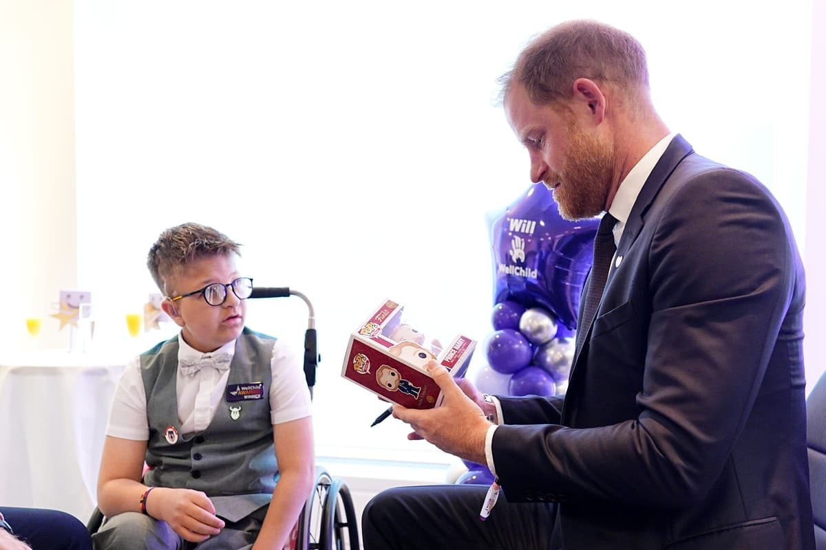 All dolled up: Harry presented with mini version of himself