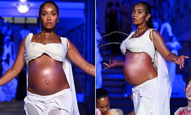 Pregnant Leigh-Anne Pinnock bares her baby bump and draws audible gasps from the crowd as her body becomes a fountain a…