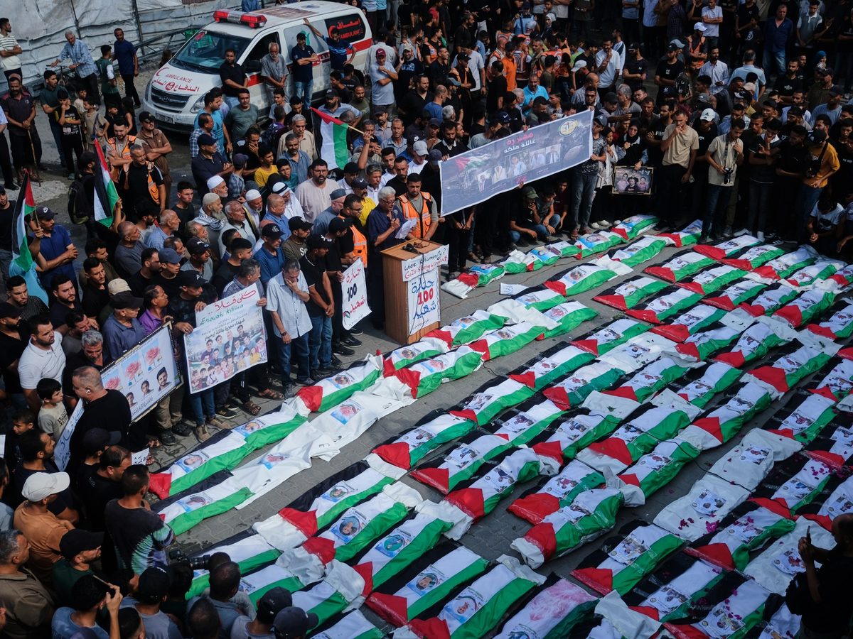 Palestinians in Gaza bury remains of 100 people recovered from rubble