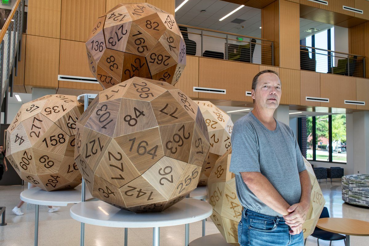 Unique, mathematical 60-sided "Go First Dice" go on display