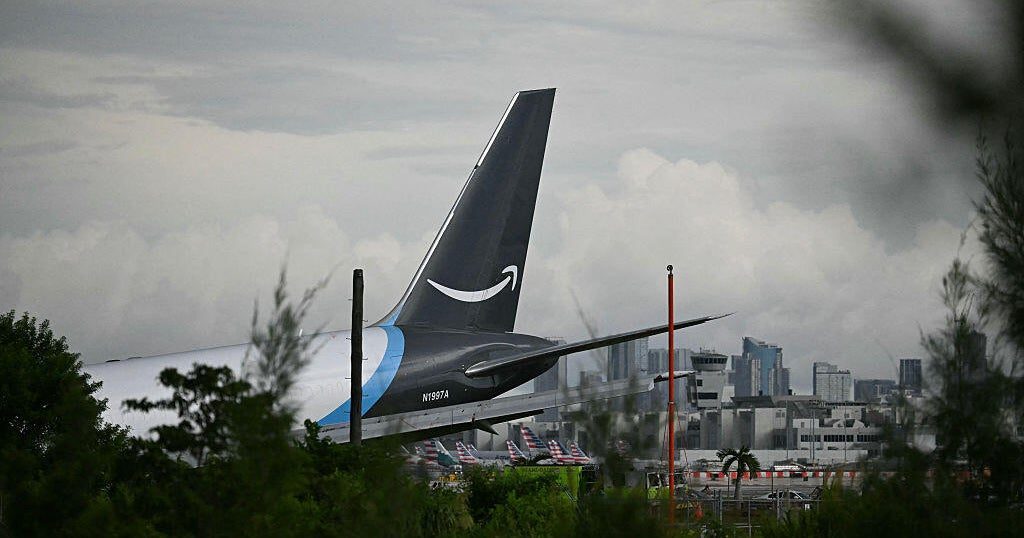 Amazon cargo overruns runway at Miami International, hits vehicles, officials say