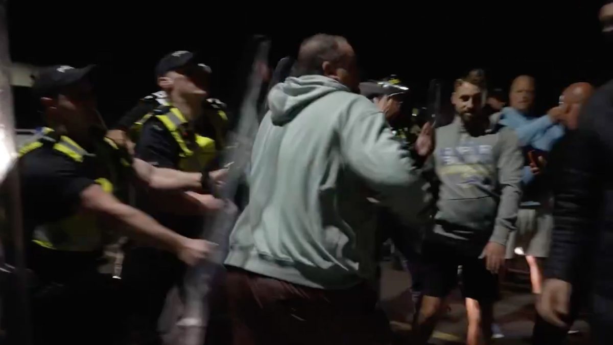 Anti-immigration protesters clash with police in UK after boat arrival