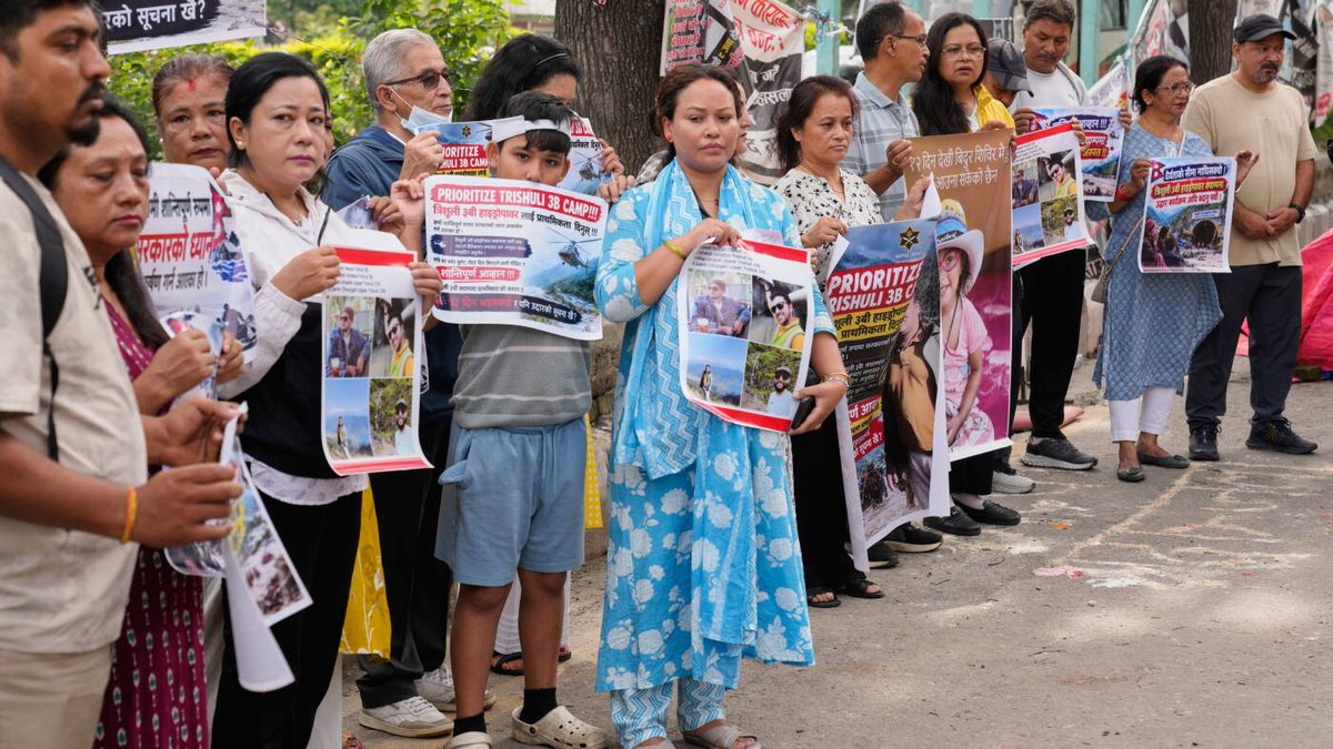 As Nepal identifies those killed in the floods, questions grow over China's reporting