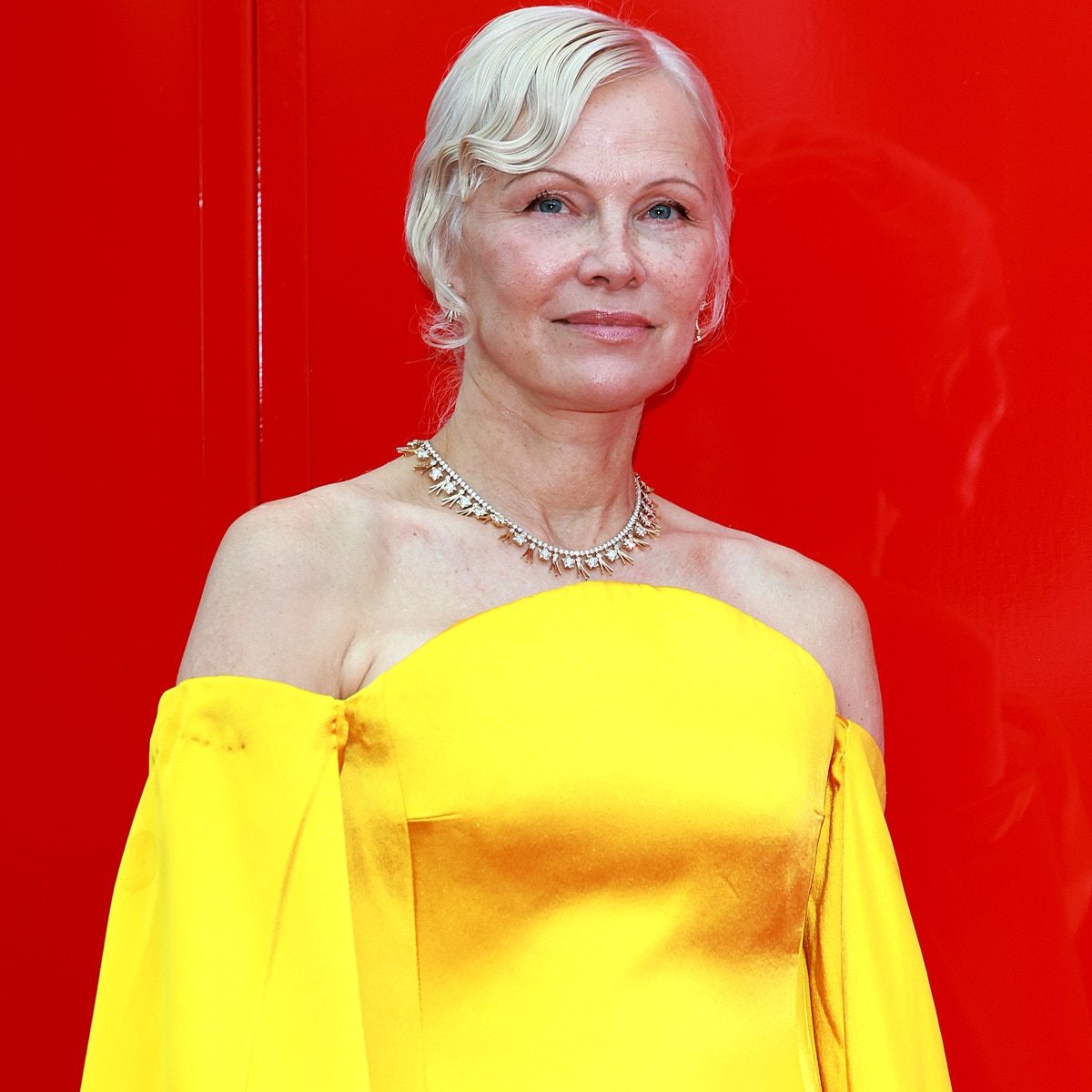 Pamela Anderson Rocks Backless Dress With Extra-High Slit in NYC