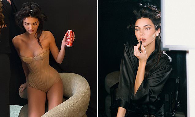 Kendall Jenner shows off her model figure as she poses in a nude corset while hydrating with a Coke backstage at L'Orea…