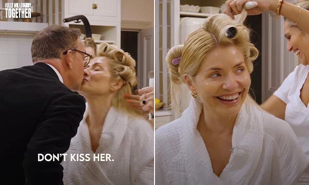 Holly Willoughby shares a sweet kiss with her husband Dan Baldwin in a rare PDA moment as she gets glammed up for the N…