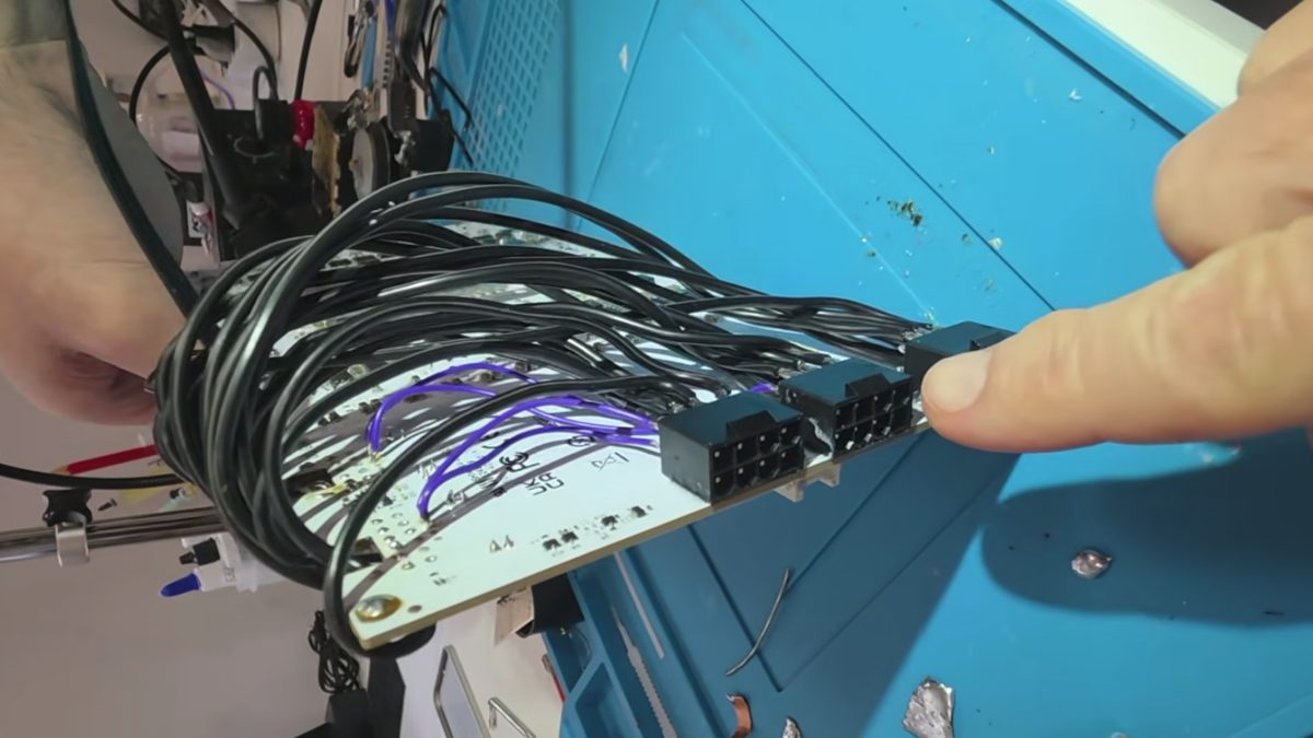 Modded RTX 5090 ditches 16-pin power for triple 8-pin connectors — draws up to 900W and hits 3,400 MHz