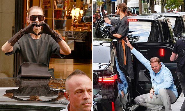 Celine Dion gets a helping hand from a member of her team as she greets fans in fabulous high heels
