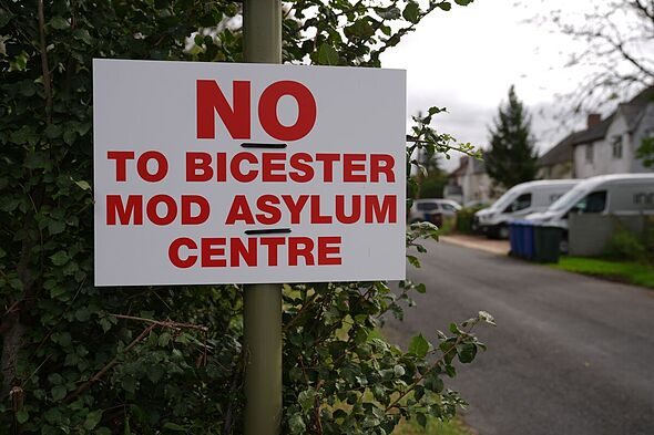 Village holding anti-asylum referendum to give high-vis vests to migrants